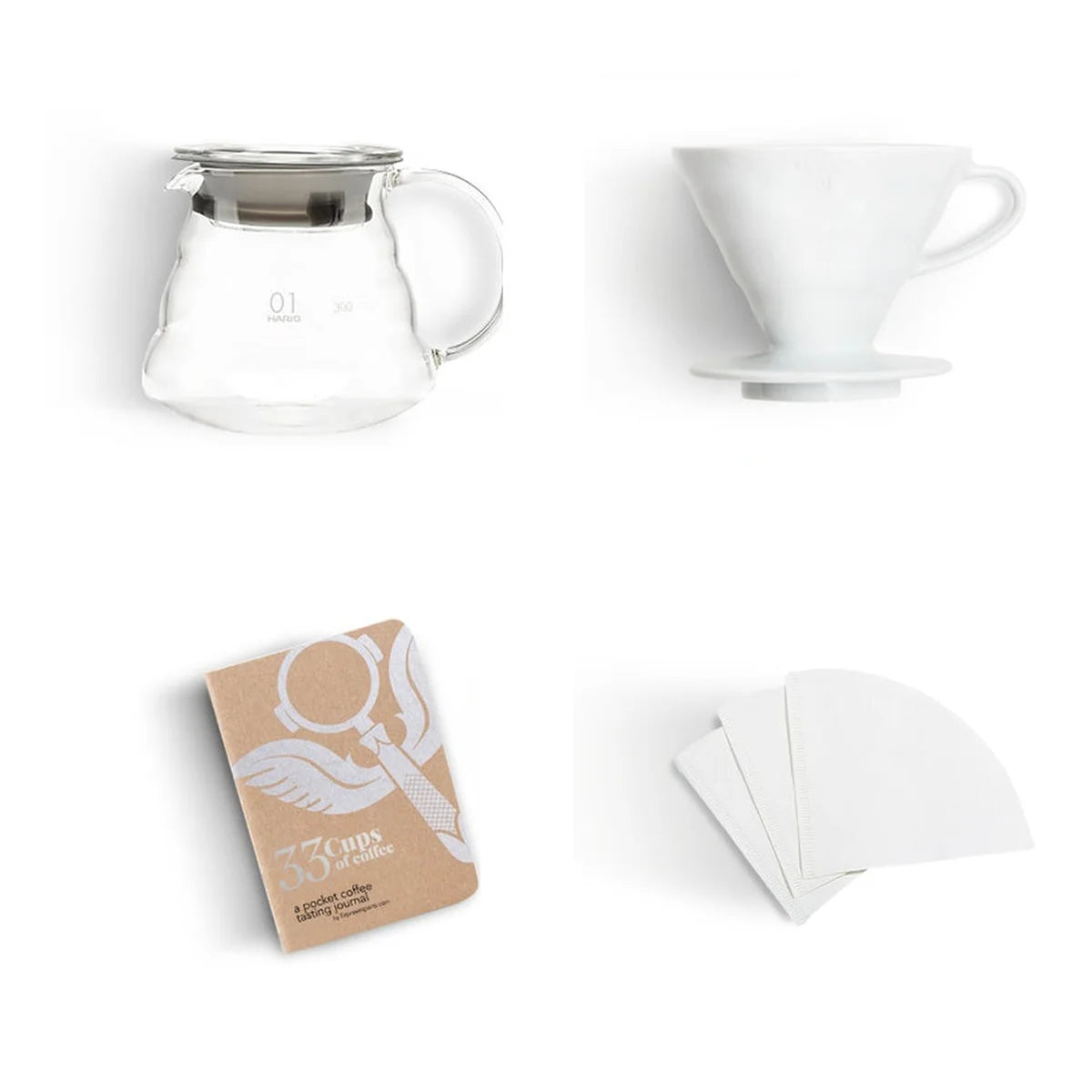 Hario V60 dripper, glass server, paper filters, and coffee tasting journal